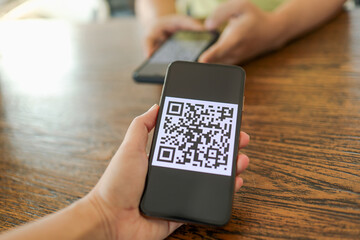 Qr code payment. E wallet. Man scanning tag accepted generate digital pay without money.scanning QR code online shopping cashless payment and verification.technology concept