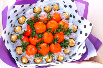 Juicy tangerine decor. Tangerines, bouquet. Citrus tangerine bouquet as a gift for a holiday.