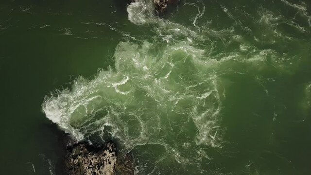 Aerial top view of the powerful flow of the mountain green river Katun. Chemal village, Altai Republic, Russia