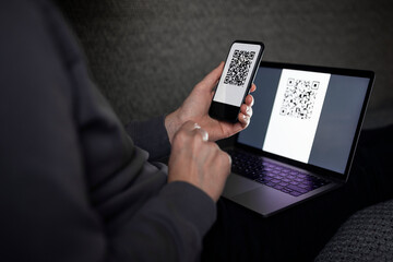 Man scanning QR code