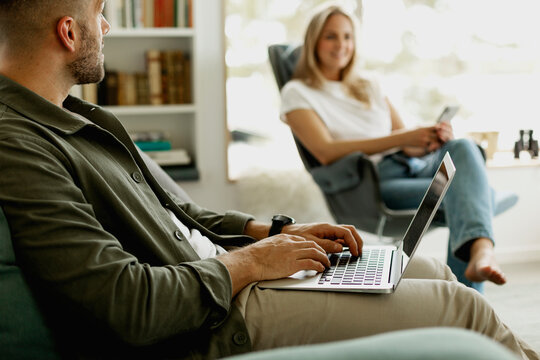Man using laptop in living room