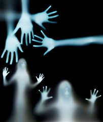 a girl  silhouette behind a  transparent  paper