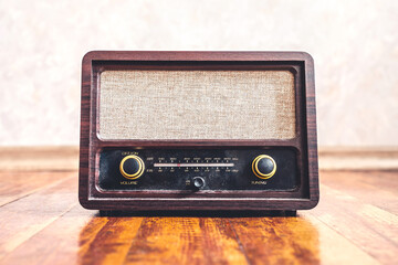 Retro vintage radio. Music nostalgia with old 60s style song player. Dusty speaker and receiver on...