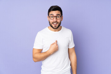 Caucasian handsome man over isolated background with surprise facial expression