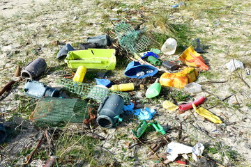 Beach with plastic pollution on sand at famous Rias Baixas Region. Galicia, Spain.