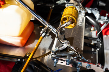 Anodized yellow Steel Brake Pedal On A Competition Go Kart
