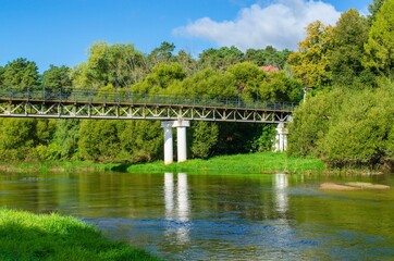 Fototapeta na wymiar bridge over the river on a summer sunny day
