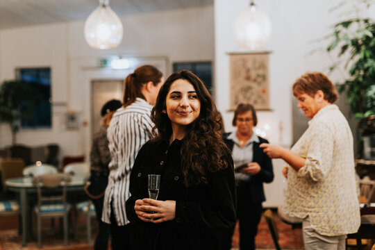 Smiling woman during work meeting in cafe