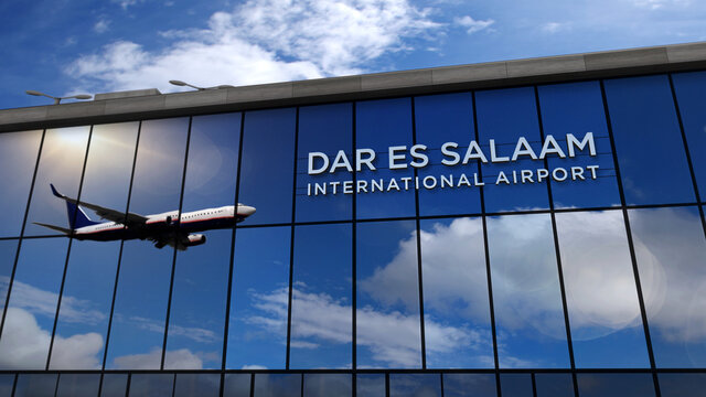 Airplane landing at Dar es Salaam Tanzania airport mirrored in terminal