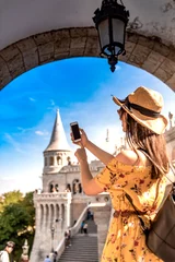 Zelfklevend Fotobehang A young woman enjoying her trip to the Castle of Budapest © Spectral-Design