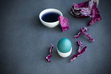Instructions how to color easter eggs with natural dye. Blue color from red cabbage. Copy space. Grey background
