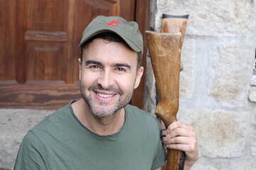Man wearing revolutionary green hat with red star