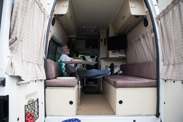 Active senior and his campervan