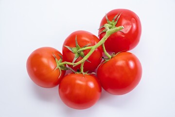 Tomato isolated food ripe red. Close-up of a tomato on a white background.