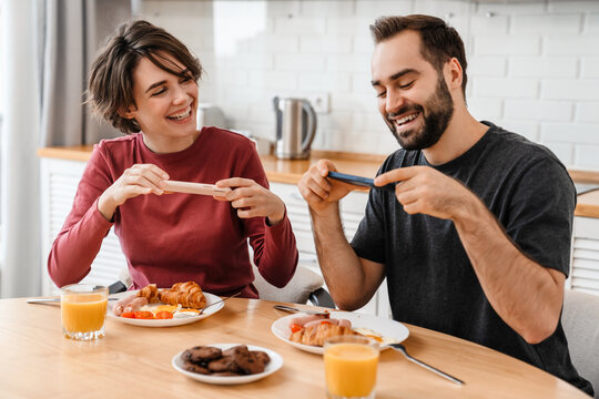Portrait of young caucasian couple taking photo