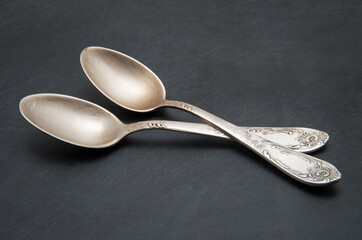 Vintage metal spoon on dark background