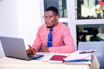 adult businessman working at laptop in office.