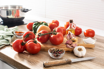 Preparing tomato sauce in the kitchen. Ingredients on the kitchen counter