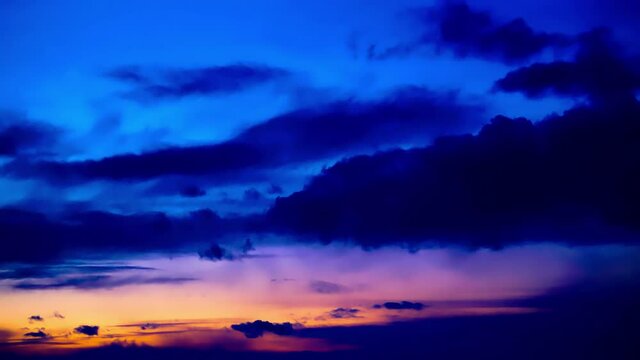4k sunset clouds hyperlapse froming from dark clear blue sky to puffy morphing cloudy orange golden burgundy purple pink violet glowing colors of awesome visual stunning movements of heavenly sight3-3