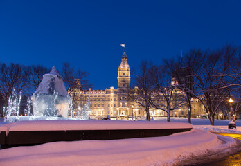 
The lighted 1886 Second Empire style Parliament Building seen during an early blue hour morning,...