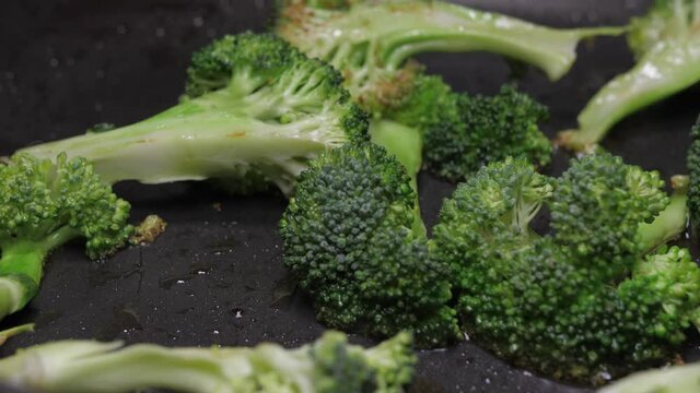 frying broccoli on oil fry pan 