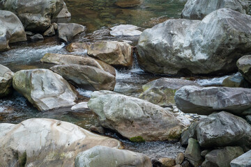 Naklejka na ściany i meble Wild river flow with rocks landscape in Taiwan.