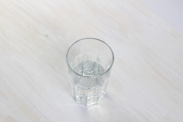 clear glass of pure water on white background