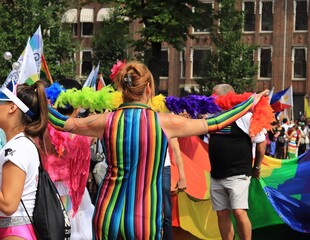 Woman with Rainbow Suit and Rainbow Feather Boa During Amsterdam Pride 2018