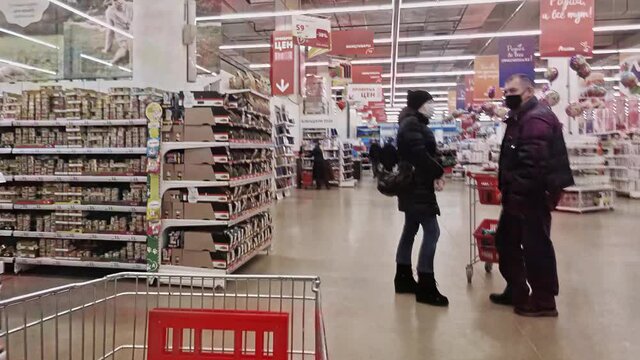View of the supermarket shopping hall from the shopping cart, time lapse