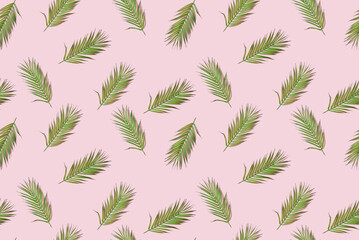 Naklejka na ściany i meble Palm leaves Seamless pattern on pink background. Organic cosmetics, travel, summertime sale banner. Top view. Trendy summer background. Wrapping paper, fabric design