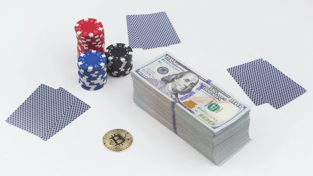 Twenty-One 21 card game with bet of bitcoin BTC, wad or stack of 100 hundred dollars bills cash USD banknotes isolated on white. Gambling
