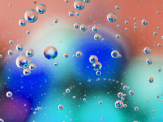 abstract background oil drops on water macro orange