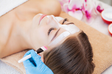 Fototapeta premium Pretty woman relaxes during spa treatments at beauty salon