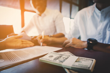 Business negotiation concept; Business people handshaking to sign contract of business at business meeting