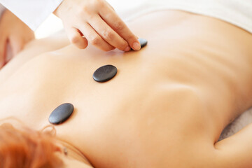 Beautiful woman spa hot stone massage beauty Treatments