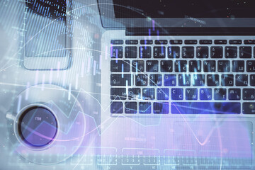 Stock market chart and top view computer on the table background. Multi exposure. Concept of financial analysis.