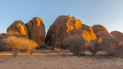 Red rock formations in the desert at sunset