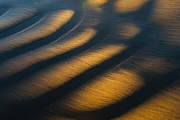 Ripple-marks on a beach at sunset