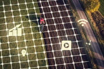 Aerial view of plowed field with computer icons