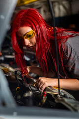 Auto car repair service center. Mechanic standing by the car. Auto mechanic working in garage....