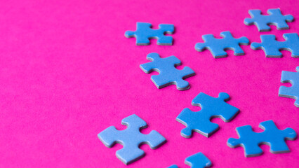 scattered puzzle pieces on colored background