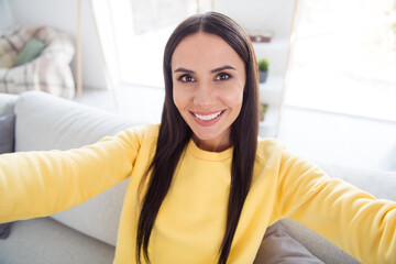 Photo of young attractive cheerful woman happy positive toothy smile make selfie record video indoors home