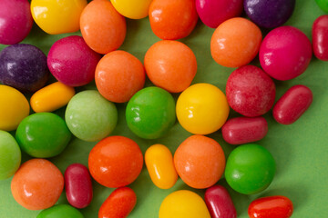 colorful little candies on a colored background