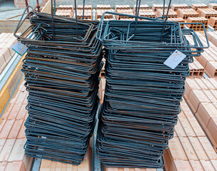 Pile of shaped iron brackets for reinforced concrete structure