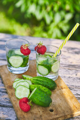 drink made from fresh chopped cucumbers with ripe strawberries. summer concept. refreshing water