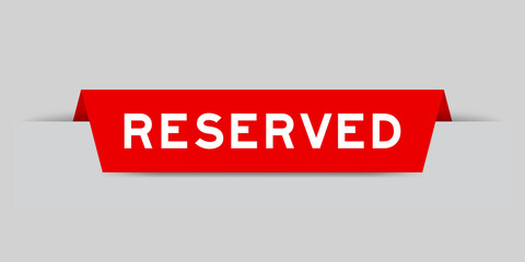Red color inserted label with word reserved on gray background