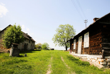 Obraz premium Countryside iwth cottages, Kielce Countryside Museum, Tokarnia, Swietokrzyskie, Poland
