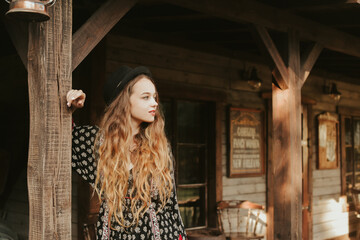 The girl meets the morning near the western house, traveling alone. A woman in a village outside the city relaxes, laughs, rest in the forest. 