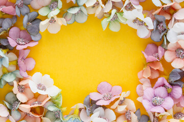 Spring banner with daisies on a yellow background with copyspace