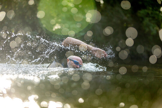 Man swimming in river